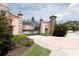 Elegant estate gate entrance with stone pillars and wrought iron gate at 1771 Ringling Blvd # 703, Sarasota, FL 34236