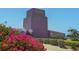 Exterior side view of building with well manicured lawn at 1771 Ringling Blvd # 703, Sarasota, FL 34236