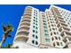 Stunning high-rise condo building featuring curved balconies and blue sky backdrop at 1771 Ringling Blvd # 703, Sarasota, FL 34236