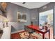 Home office boasts an accent wall, desk, and shelves at 1771 Ringling Blvd # 703, Sarasota, FL 34236