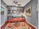 Home office boasts an accent wall, desk, and shelves at 1771 Ringling Blvd # 703, Sarasota, FL 34236