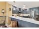 Charming kitchen with quartz countertops, stainless steel appliances, and gray cabinetry at 1771 Ringling Blvd # 703, Sarasota, FL 34236