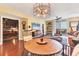 Living room with hardwood floors, modern lighting, and balcony access at 1771 Ringling Blvd # 703, Sarasota, FL 34236