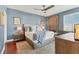 Main bedroom with hardwood floors and a ceiling fan at 1771 Ringling Blvd # 703, Sarasota, FL 34236