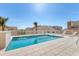 Rooftop swimming pool with lounge chairs and a fence for safety at 1771 Ringling Blvd # 703, Sarasota, FL 34236
