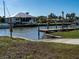 Home with boat dock along a waterfront canal community at 1846 Sandalwood Dr, Sarasota, FL 34231