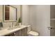 Modern half-bathroom with floating vanity and vessel sink at 211 Cosmopolitan Ct # 211, Sarasota, FL 34236