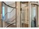 Modern home featuring a unique glass elevator adjacent to the staircase, offering convenience and style at 211 Cosmopolitan Ct # 211, Sarasota, FL 34236