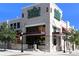 Modern Whole Foods Market exterior with large windows, awnings, and prominent signage at 211 Cosmopolitan Ct # 211, Sarasota, FL 34236
