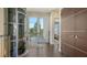 Hallway featuring private elevator access to a balcony at 211 Cosmopolitan Ct # 211, Sarasota, FL 34236
