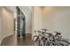 Hallway features a modern glass elevator and plenty of room for bicycle storage at 211 Cosmopolitan Ct # 211, Sarasota, FL 34236