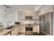 Contemporary kitchen featuring stainless appliances and modern cabinets at 211 Cosmopolitan Ct # 211, Sarasota, FL 34236