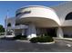Striking exterior of the public library with an eye-catching architectural design and manicured landscaping at 211 Cosmopolitan Ct # 211, Sarasota, FL 34236