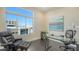 Office space with a comfortable leather chair, glass desk, and a beautiful exterior view at 211 Cosmopolitan Ct # 211, Sarasota, FL 34236
