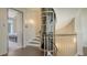 Elegant staircase and a unique glass elevator add a touch of sophistication to this modern home at 211 Cosmopolitan Ct # 211, Sarasota, FL 34236