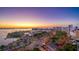 Picturesque view of a vibrant sunset over a harbor filled with boats and a cityscape skyline at 211 Cosmopolitan Ct, Sarasota, FL 34236