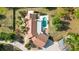 Expansive property featuring a house, pool, and mature trees, showcasing the home's layout and outdoor amenities at 265 Beaver Ct, Venice, FL 34292