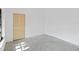 Empty bedroom features a closet with louvered doors and concrete flooring at 265 Beaver Ct, Venice, FL 34292