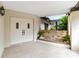 Covered front entrance with double doors and stone planter bed at 265 Beaver Ct, Venice, FL 34292