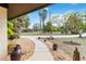 Inviting front yard with a stone walkway leading to the home, enhanced by lush landscaping and mature trees at 265 Beaver Ct, Venice, FL 34292