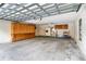 Uncluttered three-car garage with storage cabinets, utility sink and plenty of space at 265 Beaver Ct, Venice, FL 34292