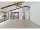 Open living area with tile floors, leading to the kitchen, hallway, and view of the pool at 265 Beaver Ct, Venice, FL 34292