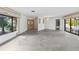 Spacious living room filled with natural light and views of lush greenery at 265 Beaver Ct, Venice, FL 34292