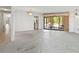 Living room features a pool view with chandelier and sliding glass doors providing access to outdoor space at 265 Beaver Ct, Venice, FL 34292