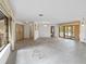 Large living room with pool view, featuring neutral walls and natural light at 265 Beaver Ct, Venice, FL 34292