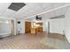 Open living space featuring a kitchen and an expansive room with unique flooring at 265 Beaver Ct, Venice, FL 34292