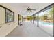 Covered outdoor patio overlooking the fenced backyard and pool at 265 Beaver Ct, Venice, FL 34292