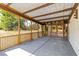 Spacious screened-in porch with concrete flooring and wooden railing at 265 Beaver Ct, Venice, FL 34292