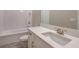 Stylish bathroom featuring white cabinets, quartz countertop, subway tile shower, and updated fixtures at 26902 Victoria Pl, Punta Gorda, FL 33955
