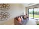 Comfortable living room with large windows that offer plenty of natural light at 26930 Lark Ct, Punta Gorda, FL 33955