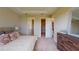 Spacious main bedroom with neutral walls, carpet flooring, and ample closet space at 26930 Lark Ct, Punta Gorda, FL 33955