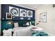 Stylish bedroom featuring creative wall decor, a telescope, and artistic lamps for a personalized touch at 26936 Lark Ct, Punta Gorda, FL 33955