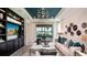 Inviting living room showcasing a built-in entertainment center and sliding glass doors to the outdoor space at 26936 Lark Ct, Punta Gorda, FL 33955
