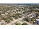 Panoramic aerial view of a quiet neighborhood, showcasing tree-lined streets and well-maintained homes at 2903 Mayflower St, Sarasota, FL 34231