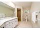 Bathroom with walk in shower and large vanity at 2903 Mayflower St, Sarasota, FL 34231