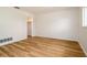 Bedroom featuring wood floors, closet and neutral paint at 2903 Mayflower St, Sarasota, FL 34231