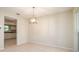 Bright dining room with tile floors, neutral walls, and access to the kitchen at 2903 Mayflower St, Sarasota, FL 34231