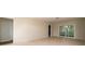 Spacious living room with neutral paint, tile flooring, and sliding door access to outside at 2903 Mayflower St, Sarasota, FL 34231