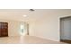 Bright living room with tile floors, neutral walls, and abundant natural light at 2903 Mayflower St, Sarasota, FL 34231