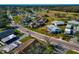 Aerial view of a neighborhood with single Gathering homes surrounded by ponds and trees on a sunny day at 303 Grayston Pl # C133, Sun City Center, FL 33573
