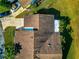 Aerial view of a single-Gathering home showing the driveway and well-maintained landscaping at 303 Grayston Pl # C133, Sun City Center, FL 33573