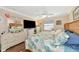 Bedroom featuring a comfortable bed and coastal decor at 303 Grayston Pl # C133, Sun City Center, FL 33573