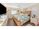 Bedroom featuring a comfortable bed and coastal decor at 303 Grayston Pl # C133, Sun City Center, FL 33573