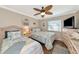 Inviting bedroom with twin beds, ceiling fan, and beach-inspired accents for a serene escape at 303 Grayston Pl # C133, Sun City Center, FL 33573