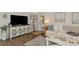 Comfortable living room with hardwood floors, neutral tones, and stylish decor at 303 Grayston Pl # C133, Sun City Center, FL 33573