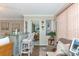 Inviting living area featuring a cozy bar, comfortable seating, and stylish nautical decorations at 303 Grayston Pl # C133, Sun City Center, FL 33573